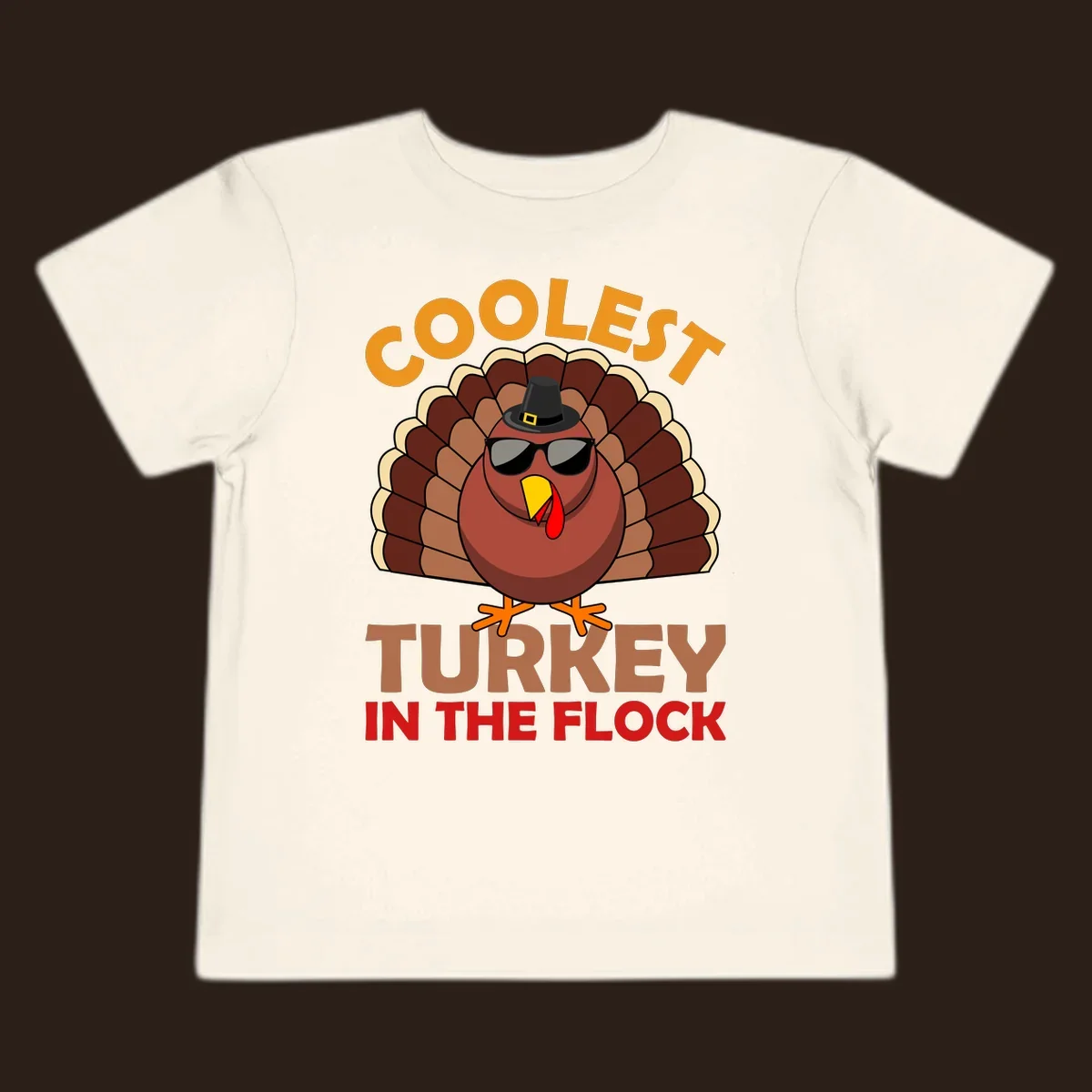 Coolest turkey in the flock Thanksgiving illustration with a turkey wearing sunglasses and a hat.