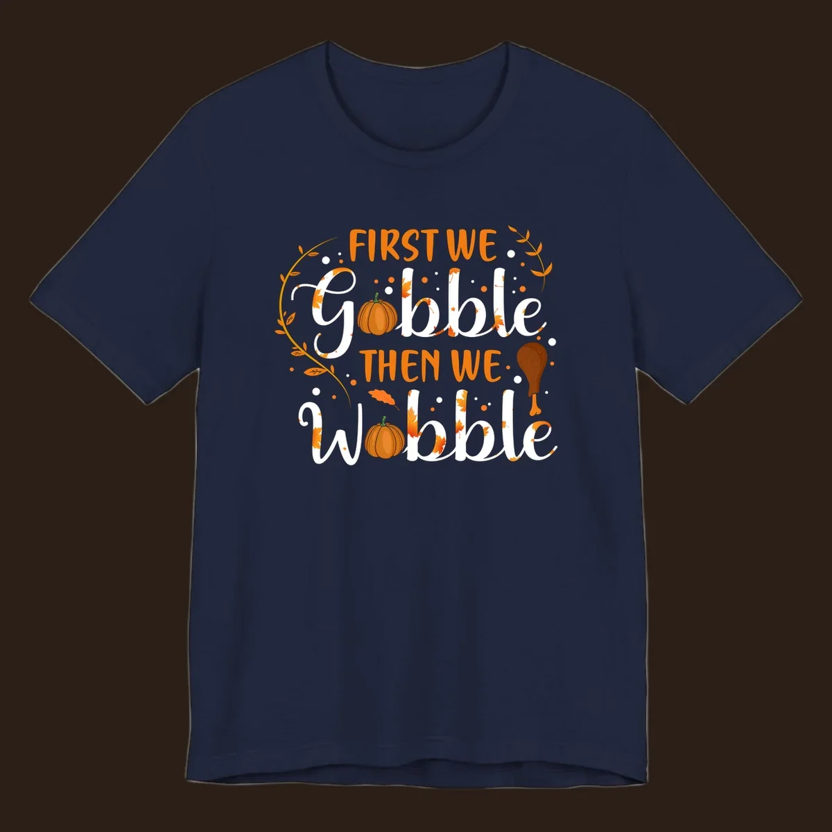 First we gobble then we wobble thanksgiving design with pumpkins and fall leaves.