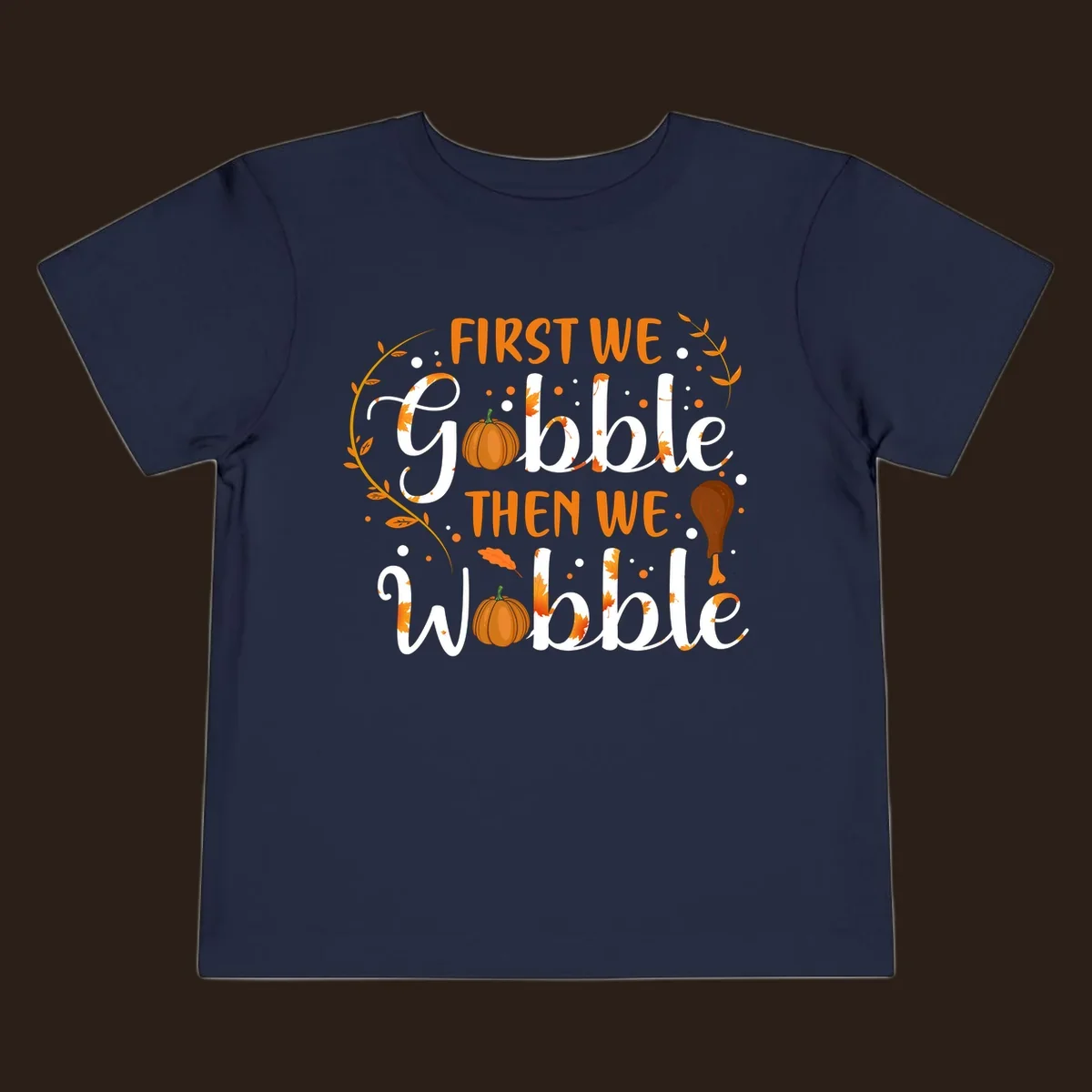 First we gobble then we wobble thanksgiving design with pumpkins and fall leaves.