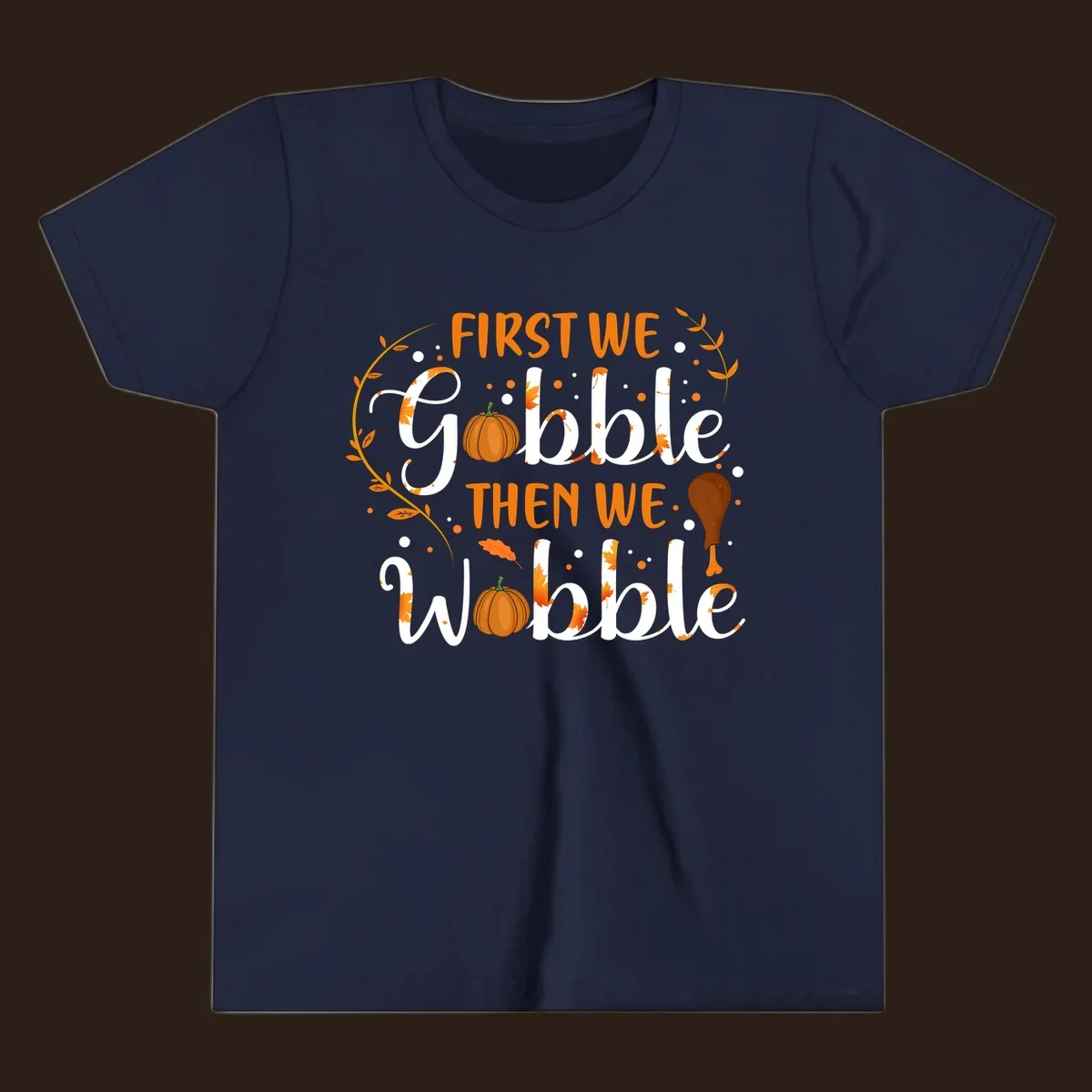 First we gobble then we wobble thanksgiving design with pumpkins and fall leaves.