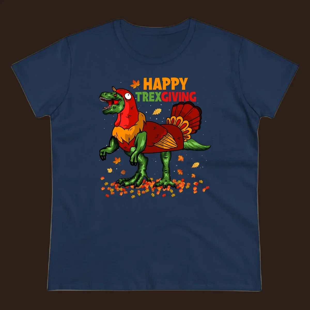Dinosaur in a turkey costume with 'Happy Trexgiving' text and fall leaves.