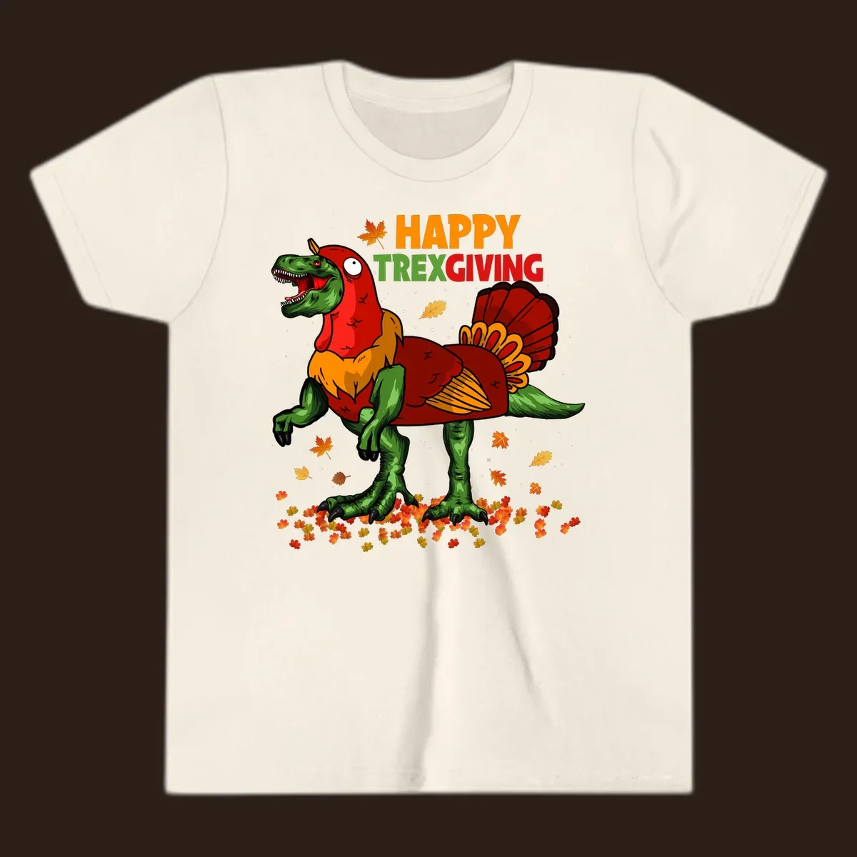 Dinosaur in a turkey costume with 'Happy Trexgiving' text and fall leaves.