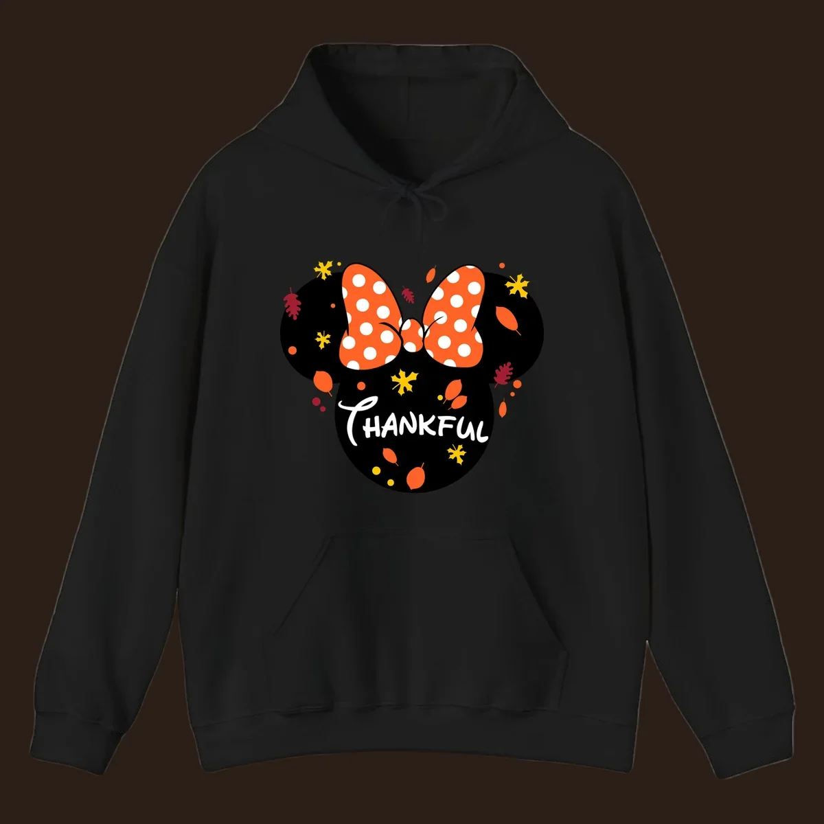 Minnie Mouse silhouette with polka dot bow and 'THANKFUL' text, surrounded by fall leaves.
