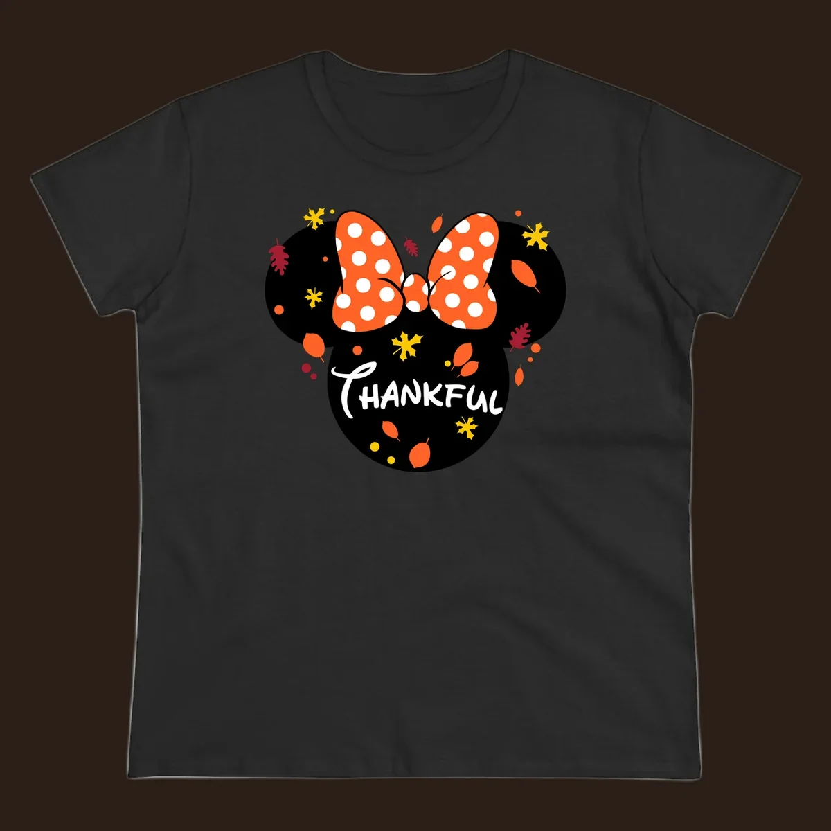 Minnie Mouse silhouette with polka dot bow and 'THANKFUL' text, surrounded by fall leaves.