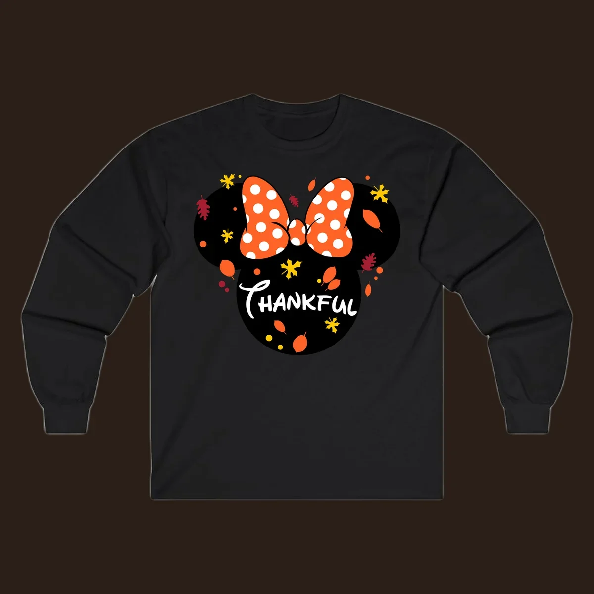 Minnie Mouse silhouette with polka dot bow and 'THANKFUL' text, surrounded by fall leaves.