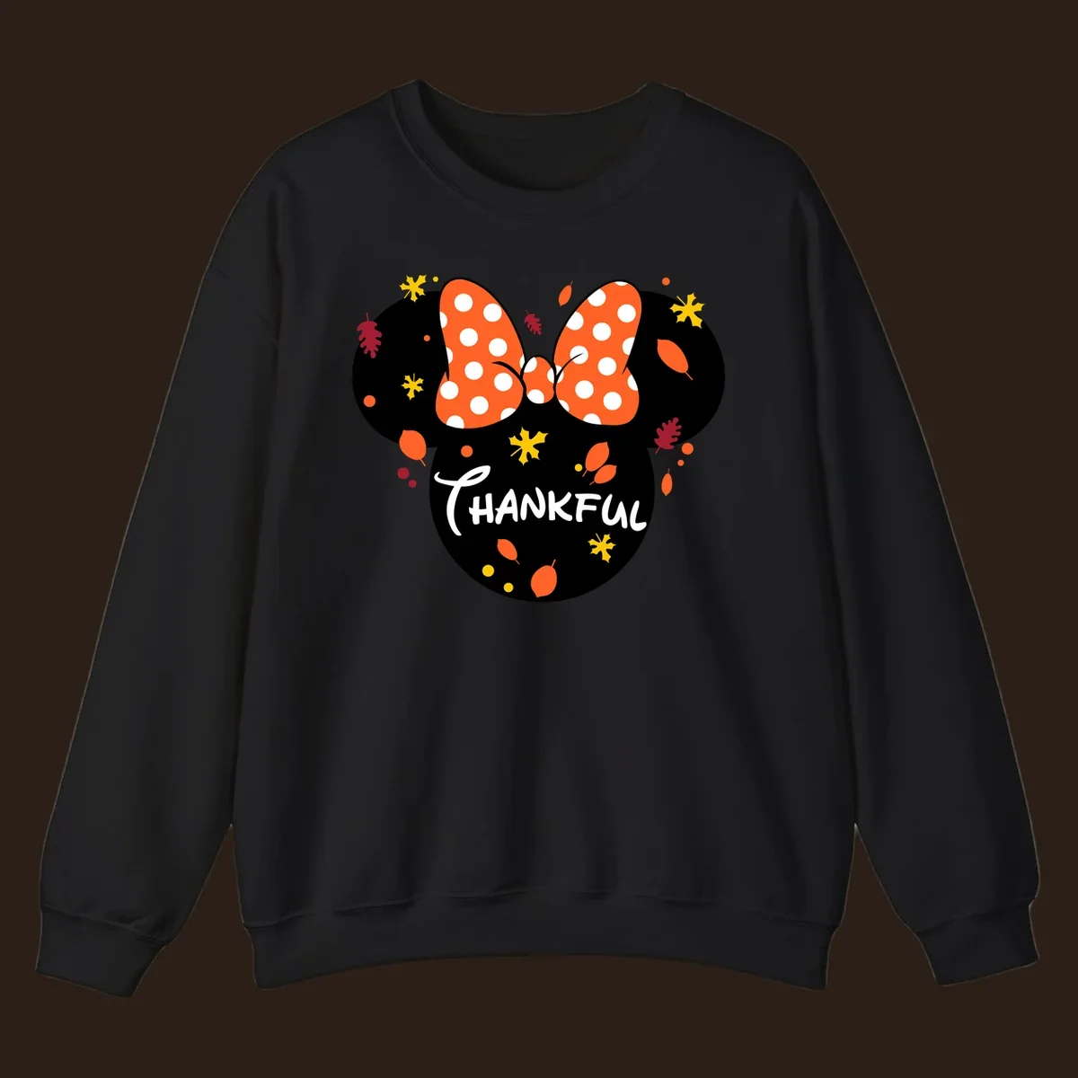 Minnie Mouse silhouette with polka dot bow and 'THANKFUL' text, surrounded by fall leaves.