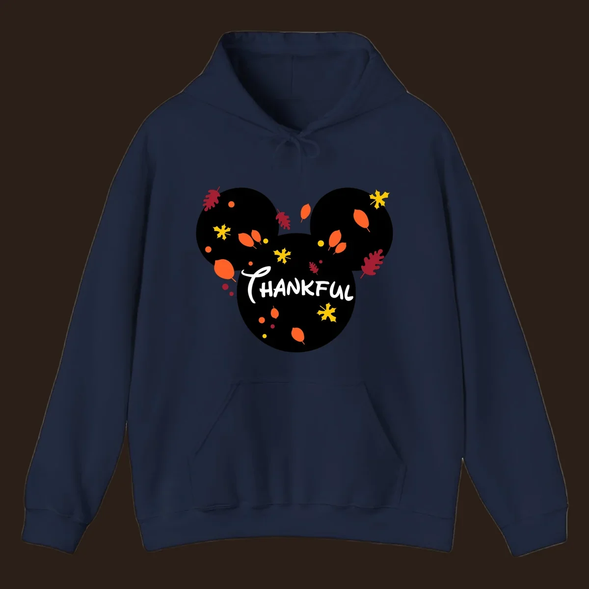 Mickey ears shape with fall leaves and the word THANKFUL in white text.