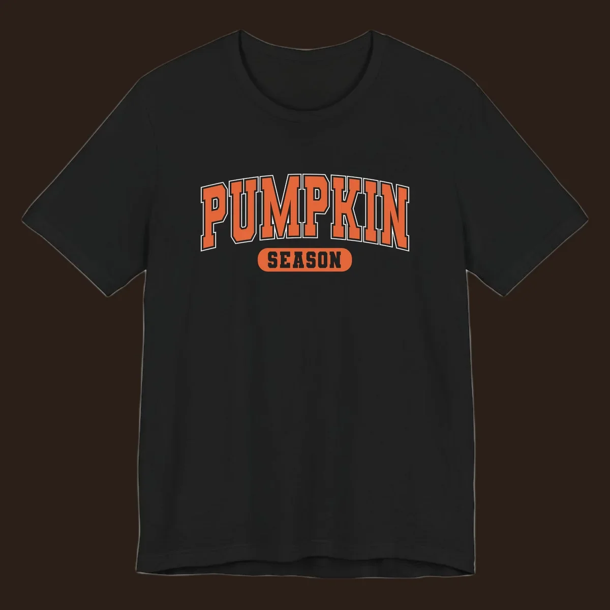 Pumpkin Season varsity text design in orange and white on black background.