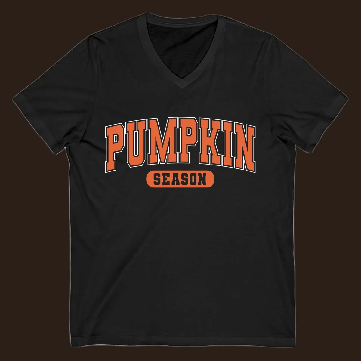 Pumpkin Season varsity text design in orange and white on black background.