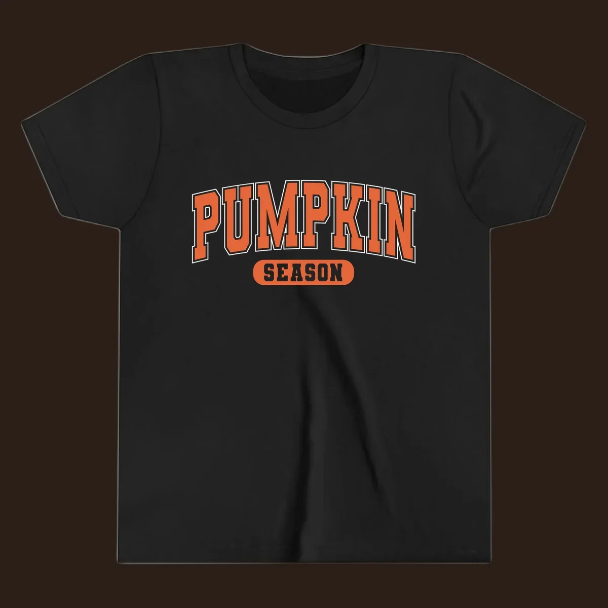 Pumpkin Season varsity text design in orange and white on black background.