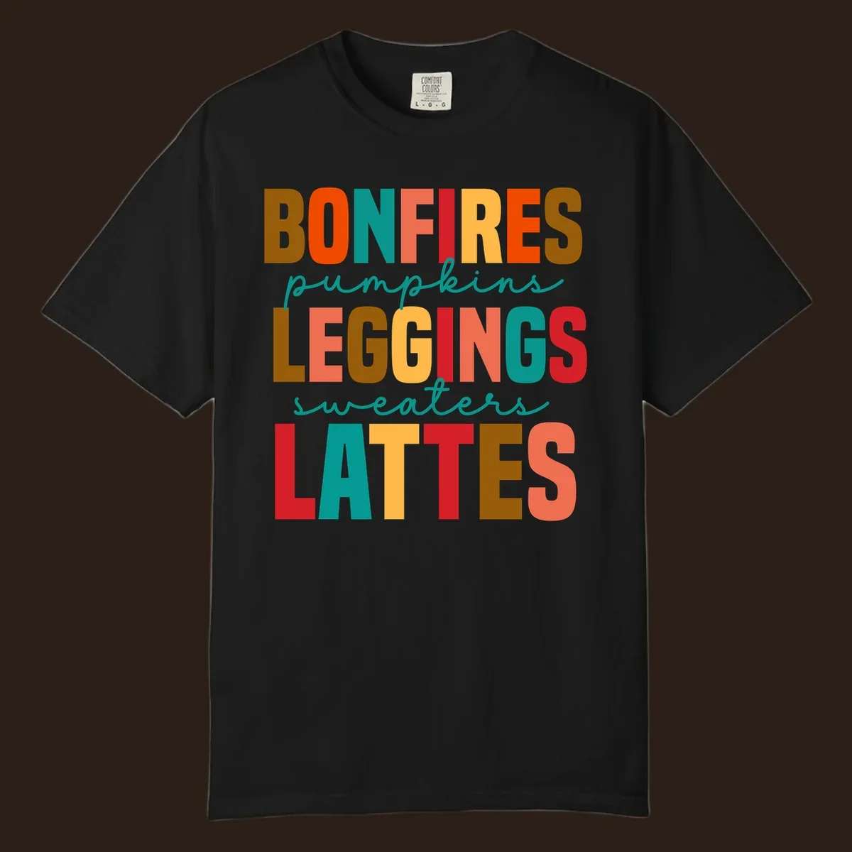 Fall vibes text design with words like Bonfires, Pumpkins, Leggings, Sweaters, Lattes in colorful block letters.