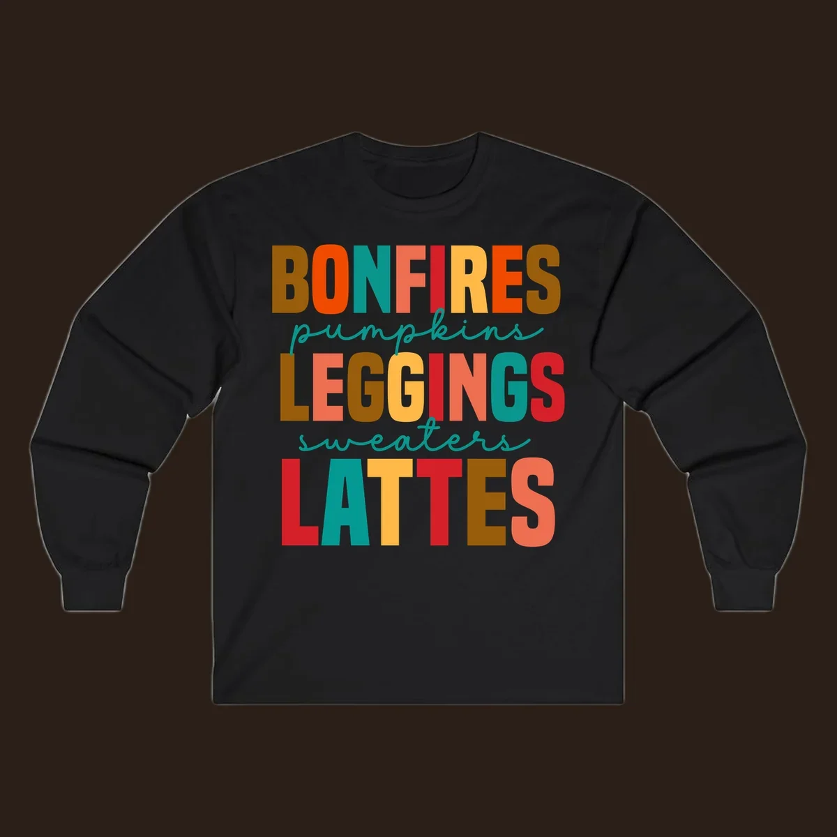 Fall vibes text design with words like Bonfires, Pumpkins, Leggings, Sweaters, Lattes in colorful block letters.
