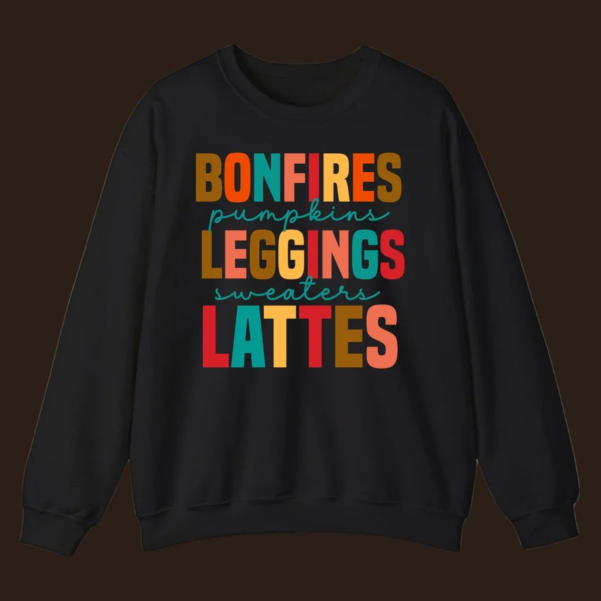 Fall vibes text design with words like Bonfires, Pumpkins, Leggings, Sweaters, Lattes in colorful block letters.