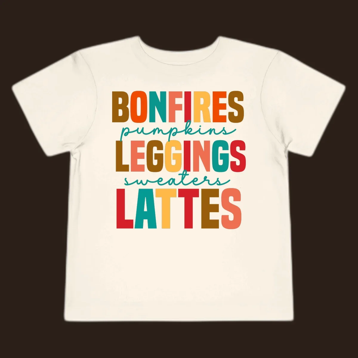Fall vibes text design with words like Bonfires, Pumpkins, Leggings, Sweaters, Lattes in colorful block letters.