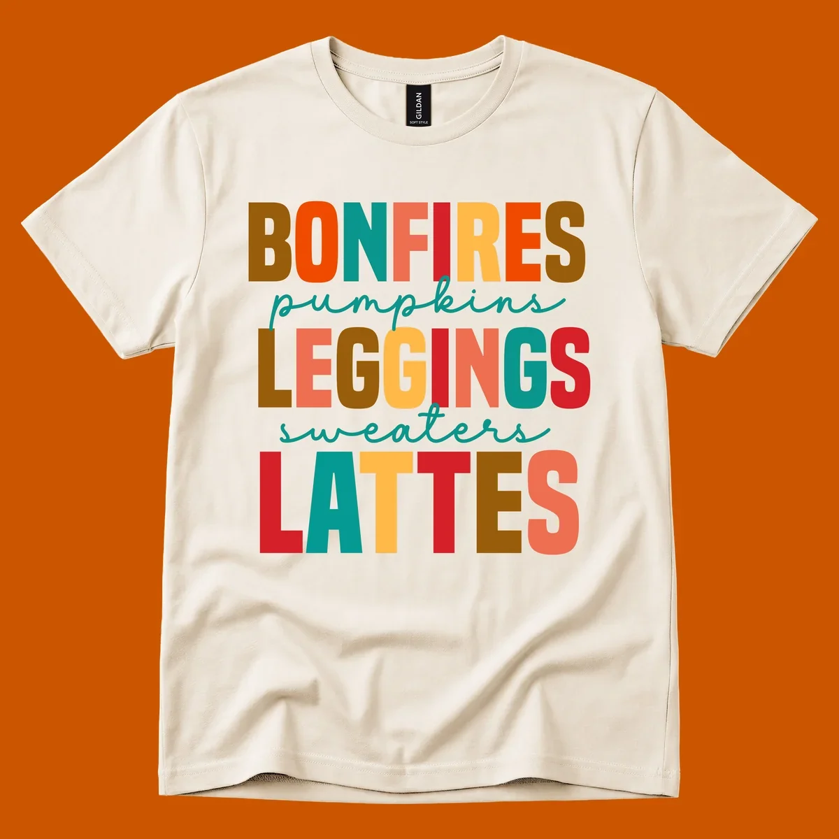 Fall vibes text design with words like Bonfires, Pumpkins, Leggings, Sweaters, Lattes in colorful block letters.