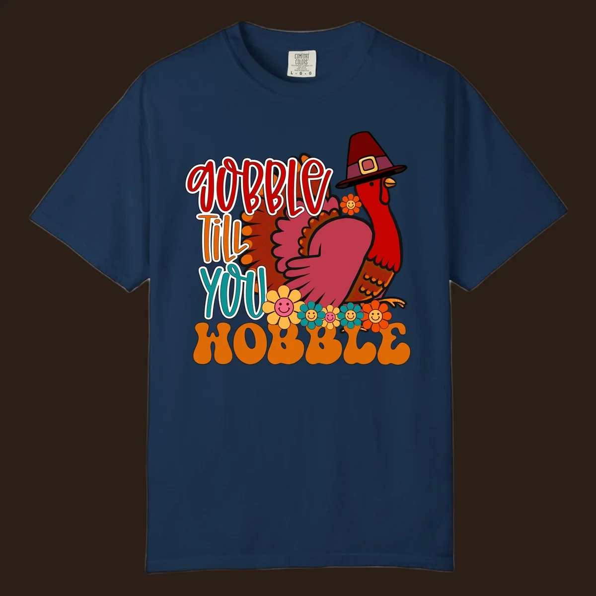 Gobble Till You Hobble Thanksgiving Turkey design with retro flowers and pilgrim hat.