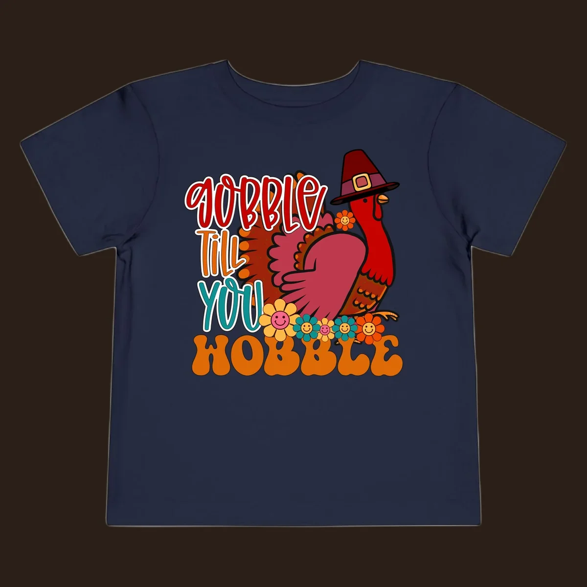 Gobble Till You Hobble Thanksgiving Turkey design with retro flowers and pilgrim hat.