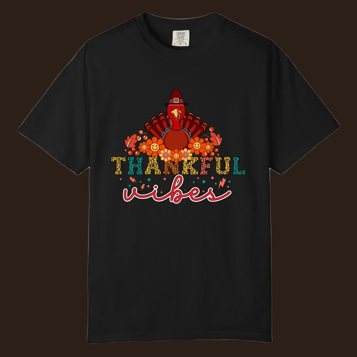 Retro Thanksgiving thankful vibes design with a turkey, flowers, and leopard print text.