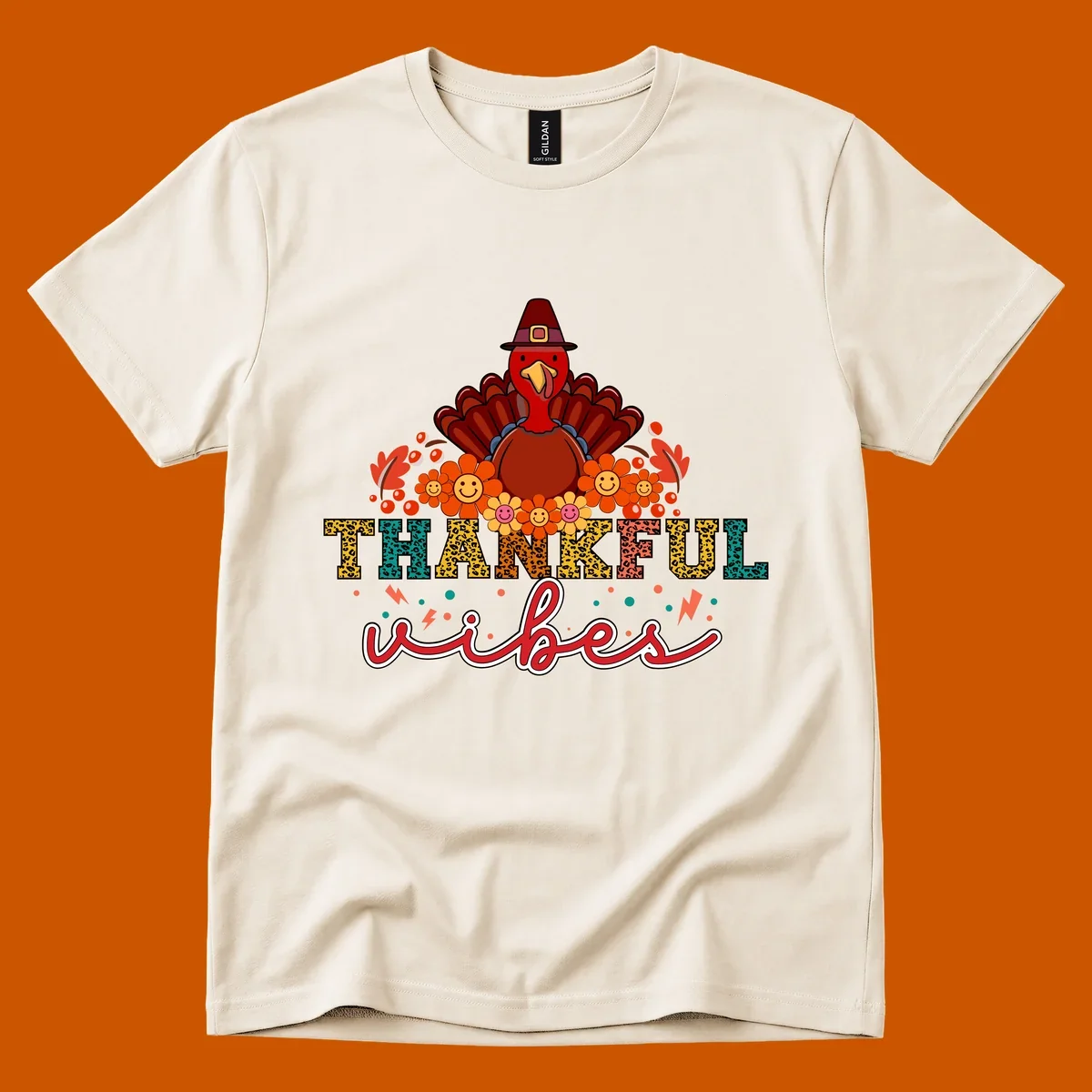 Retro Thanksgiving thankful vibes design with a turkey, flowers, and leopard print text.