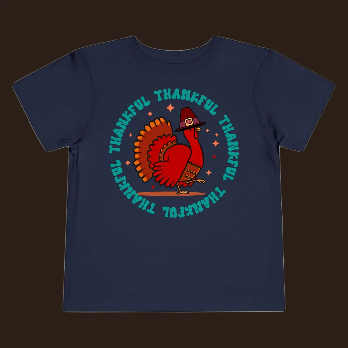 Thanksgiving turkey wearing a pilgrim hat with 'THANKFUL' text and starbursts.