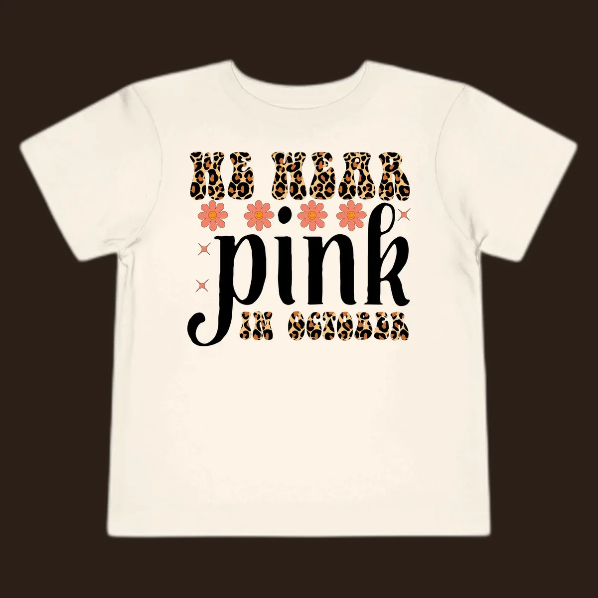 Retro "WE WEAR pink IN OCTOBER" design with leopard print and smiling flowers.
