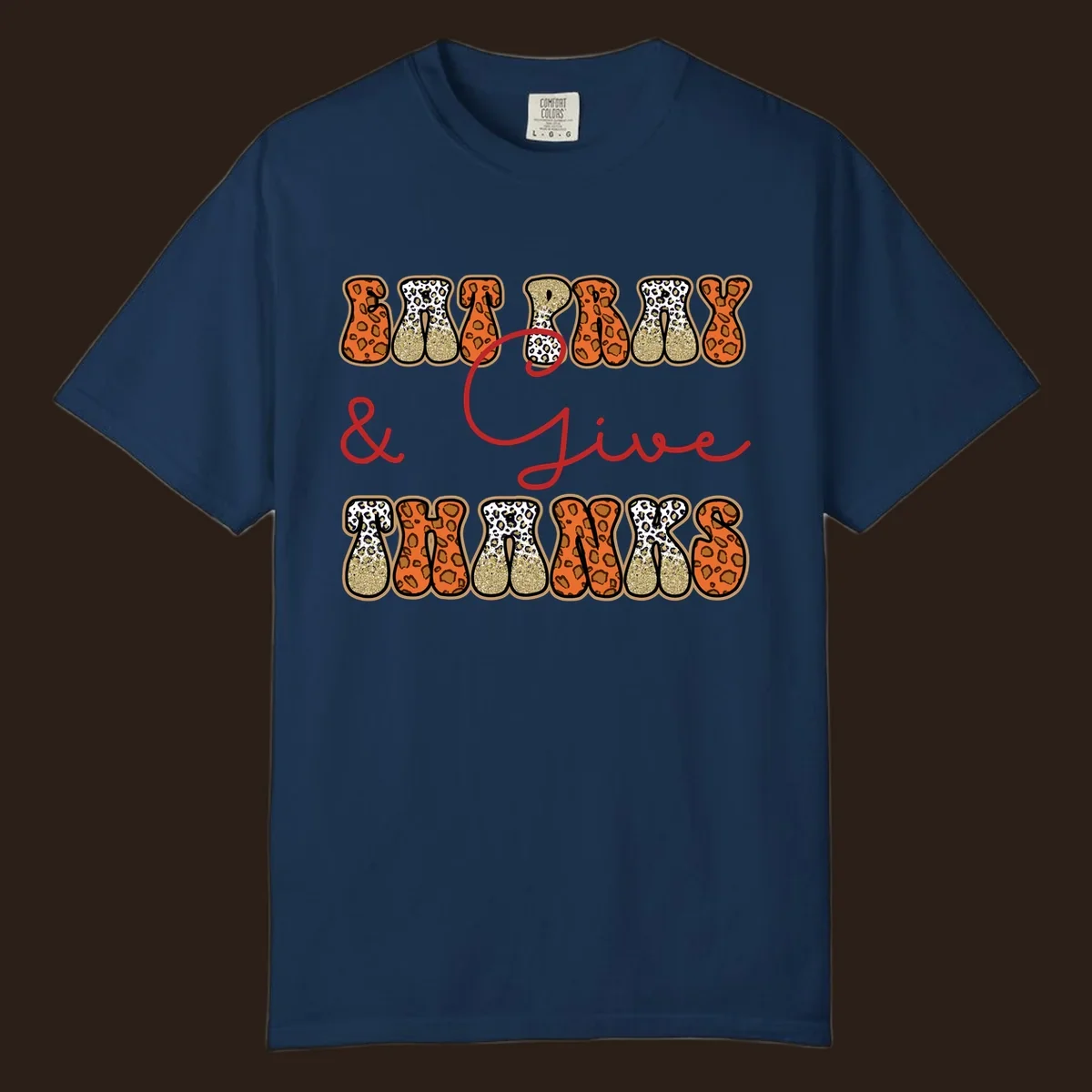 Eat Pray Give Thanks leopard print text design with gold glitter accents.