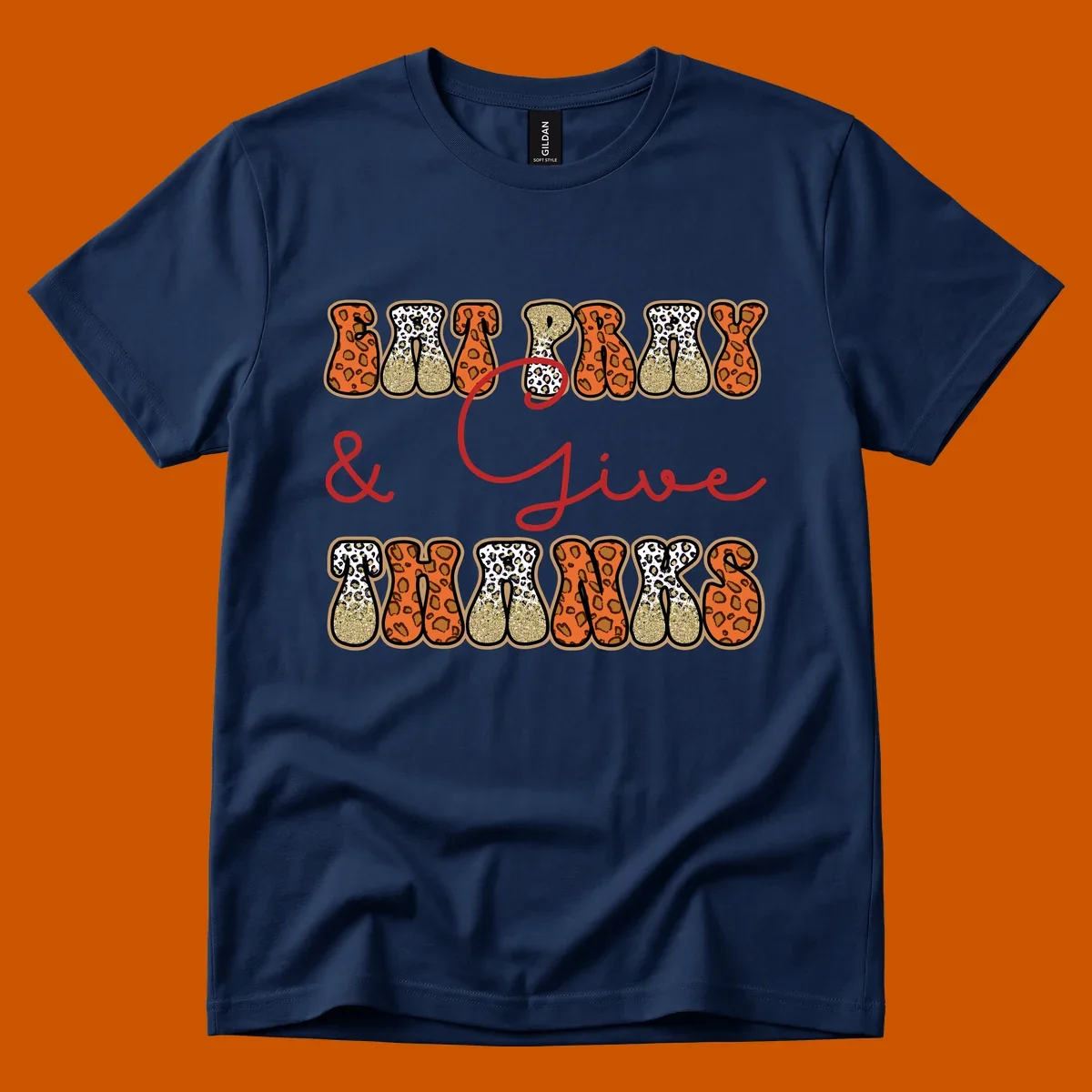 Eat Pray Give Thanks leopard print text design with gold glitter accents.