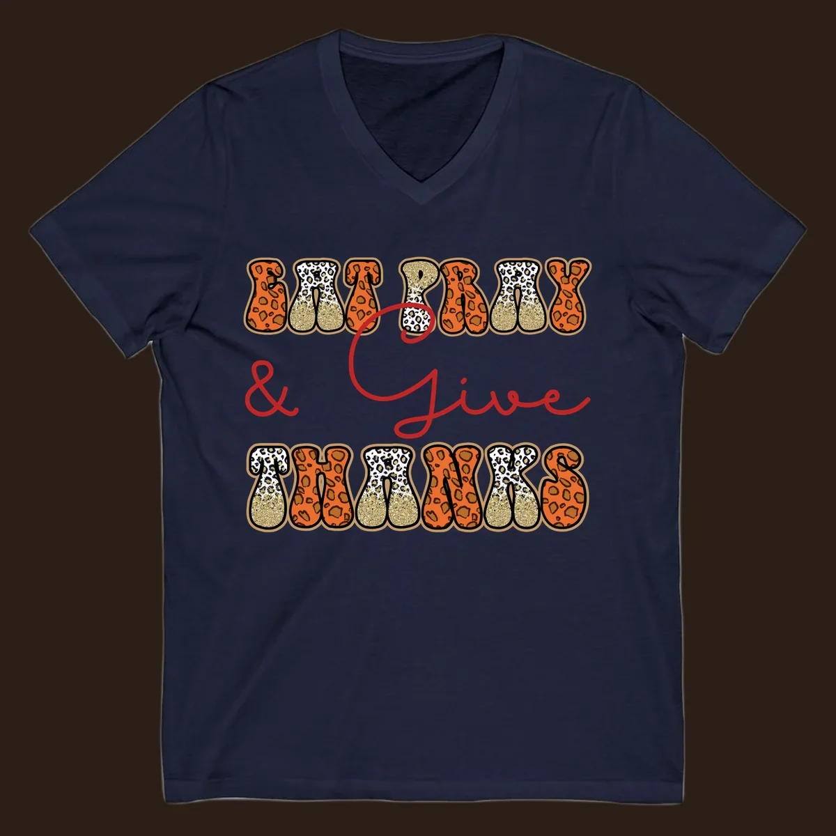 Eat Pray Give Thanks leopard print text design with gold glitter accents.