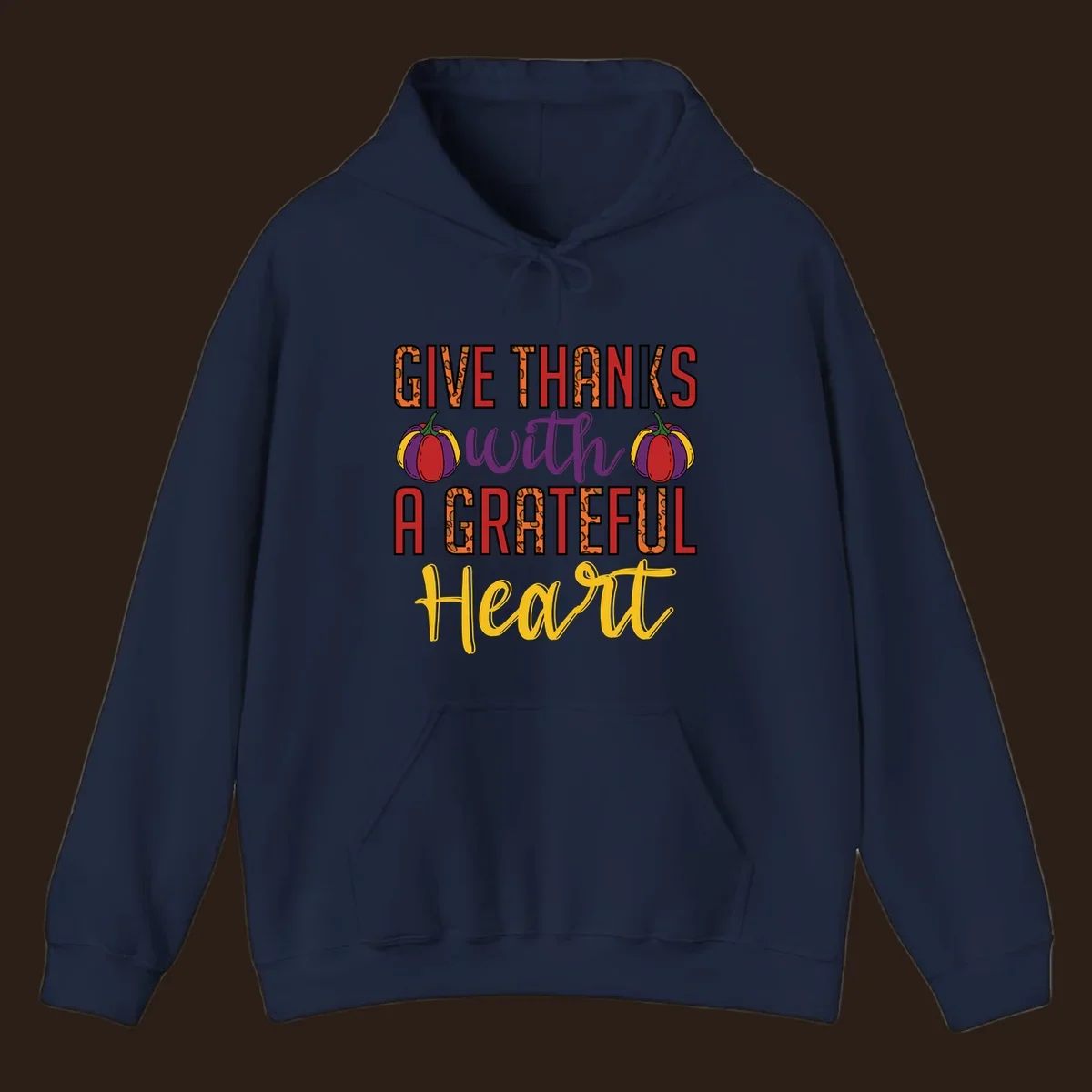 Give Thanks With A Heart typography and pumpkin design.