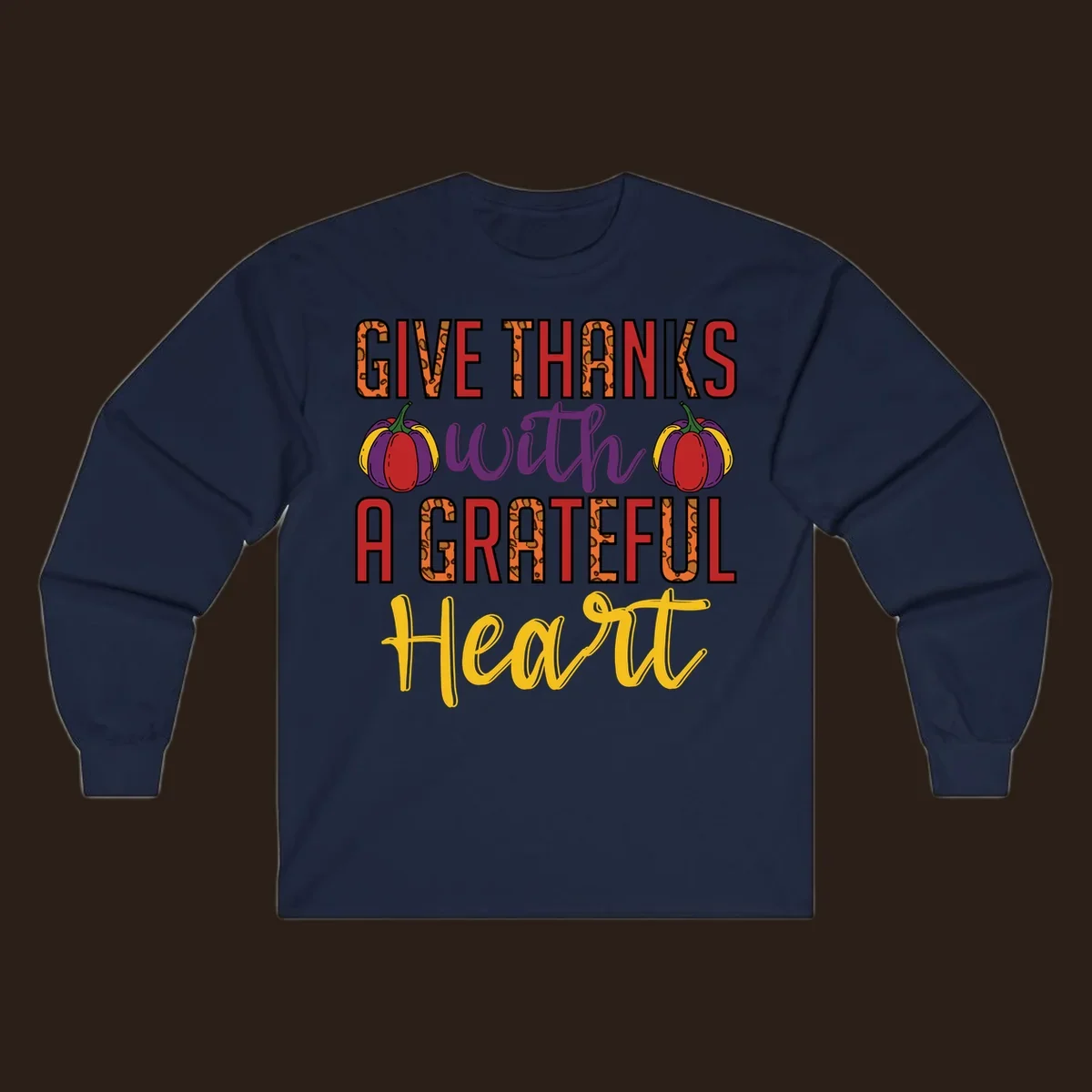 Give Thanks With A Heart typography and pumpkin design.