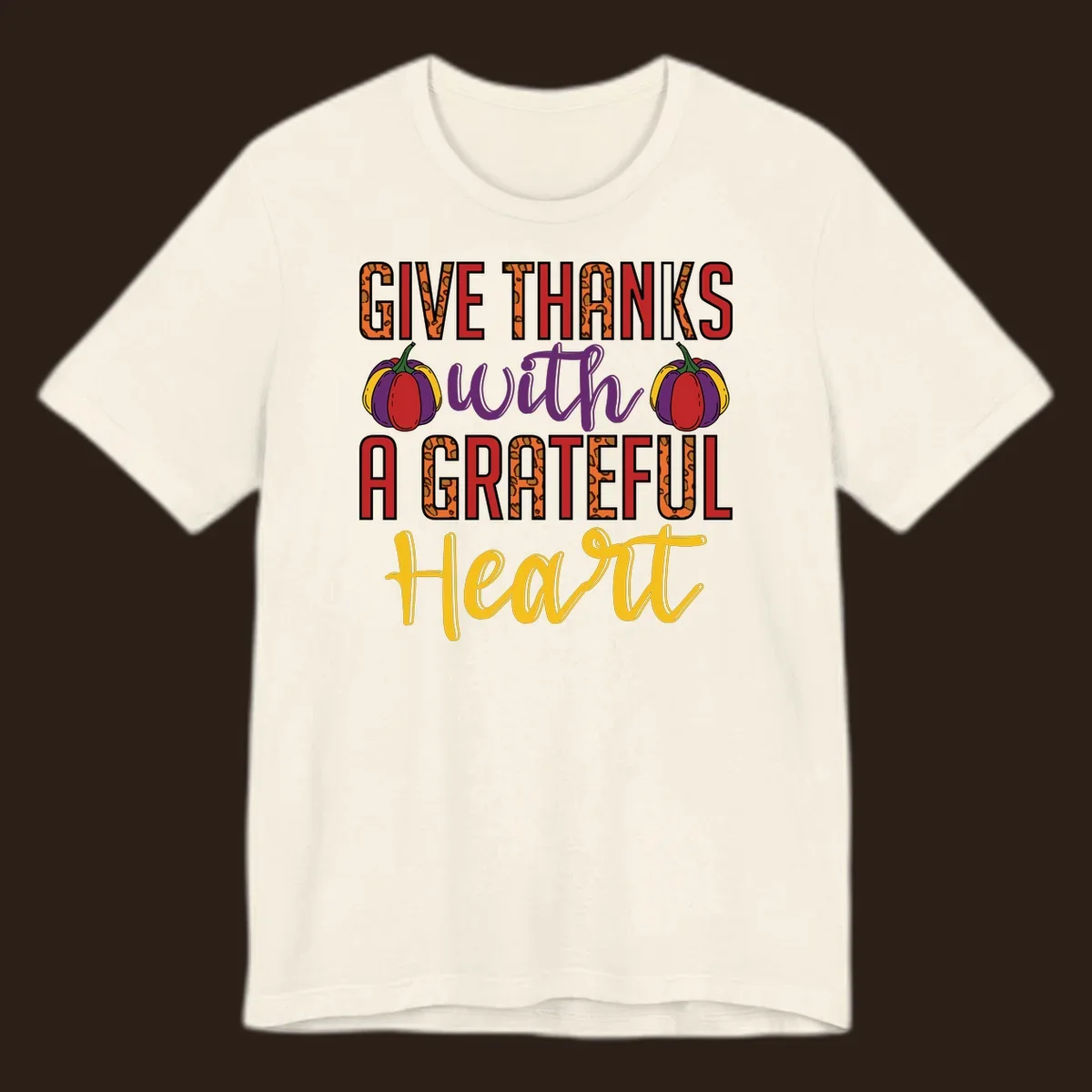 Give Thanks With A Heart typography and pumpkin design.