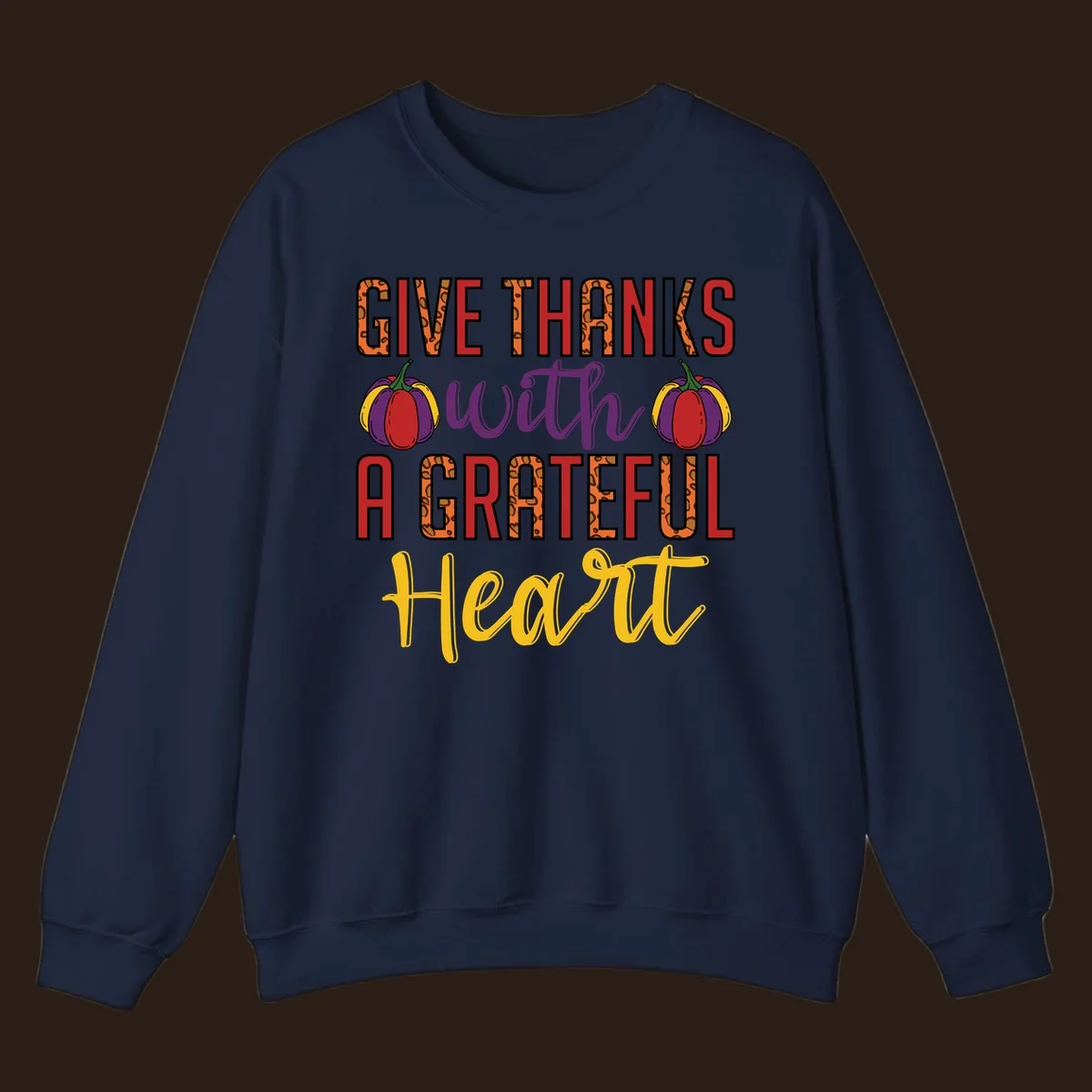 Give Thanks With A Heart typography and pumpkin design.