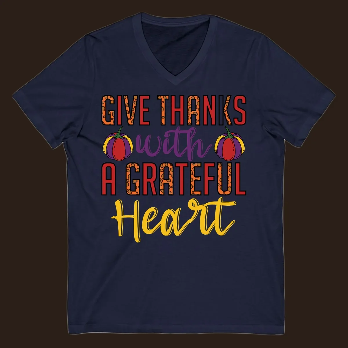 Give Thanks With A Heart typography and pumpkin design.