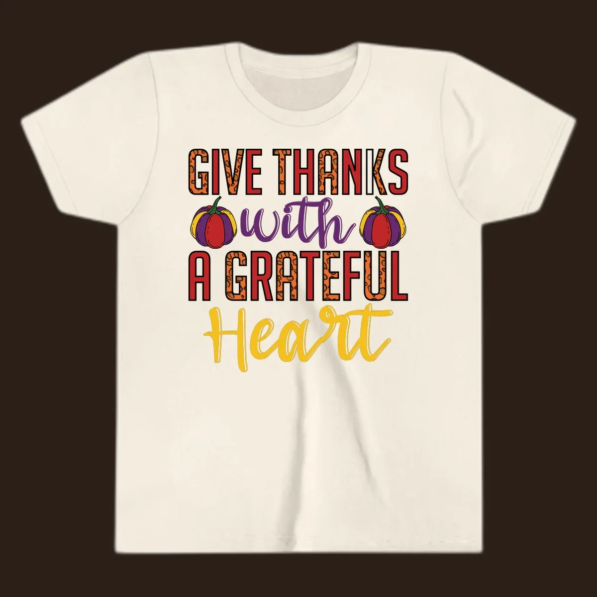 Give Thanks With A Heart typography and pumpkin design.