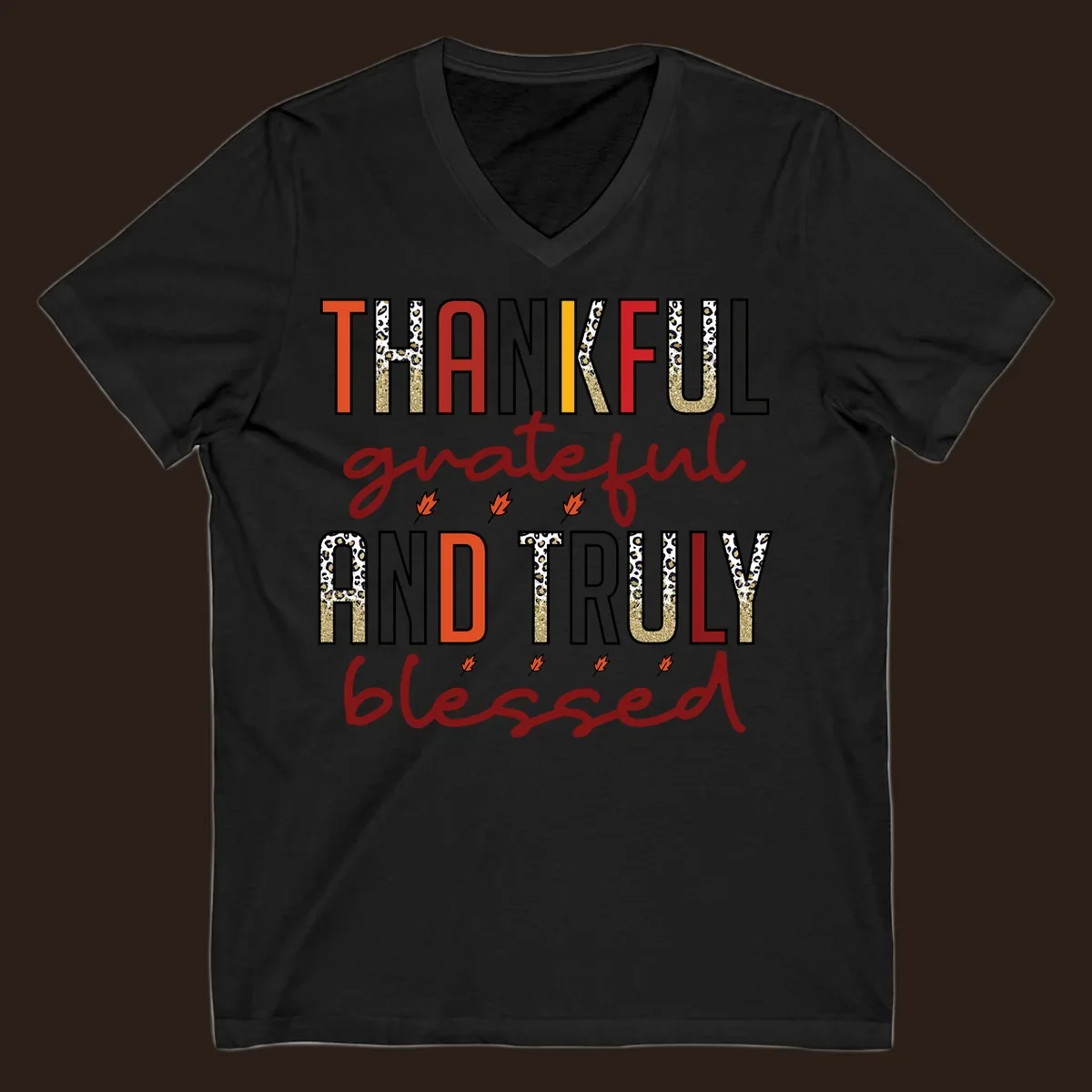 Thankful grateful and truly blessed typography with fall leaf and leopard print accents.