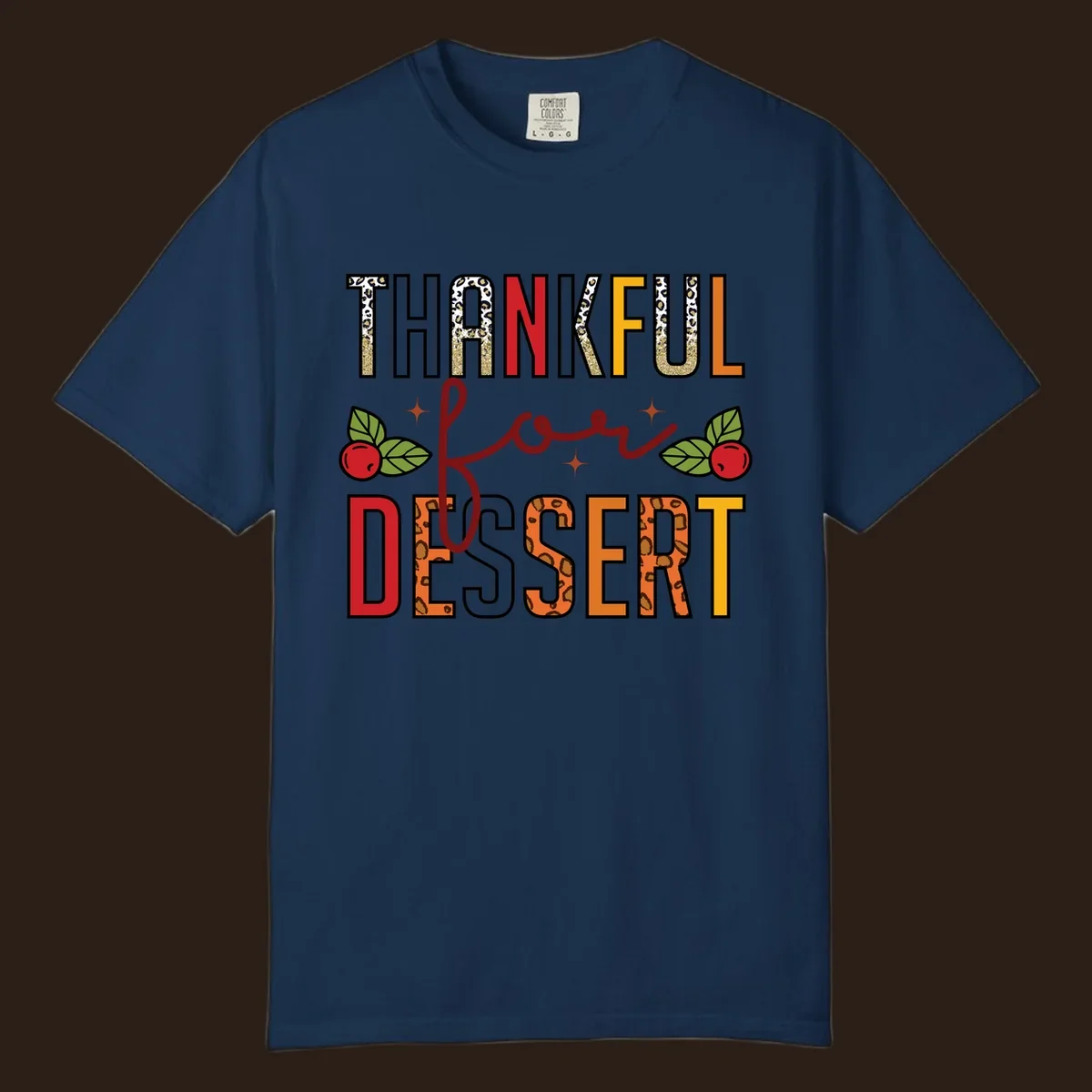 Thankful for Dessert typography with leopard print and cranberries on a dark background.