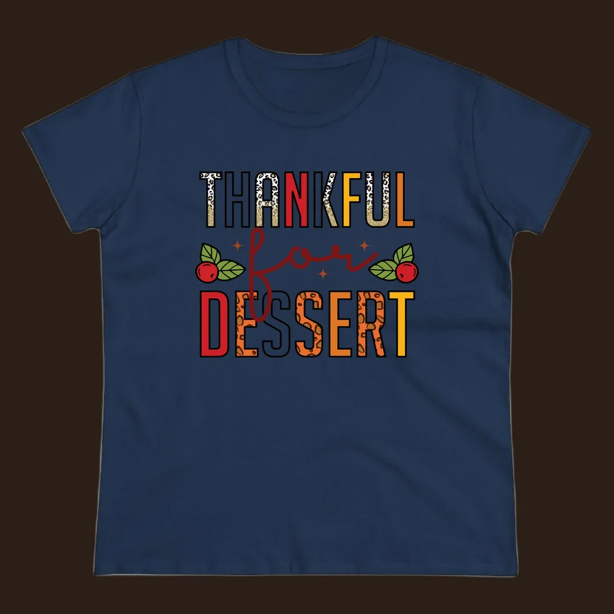 Thankful for Dessert typography with leopard print and cranberries on a dark background.