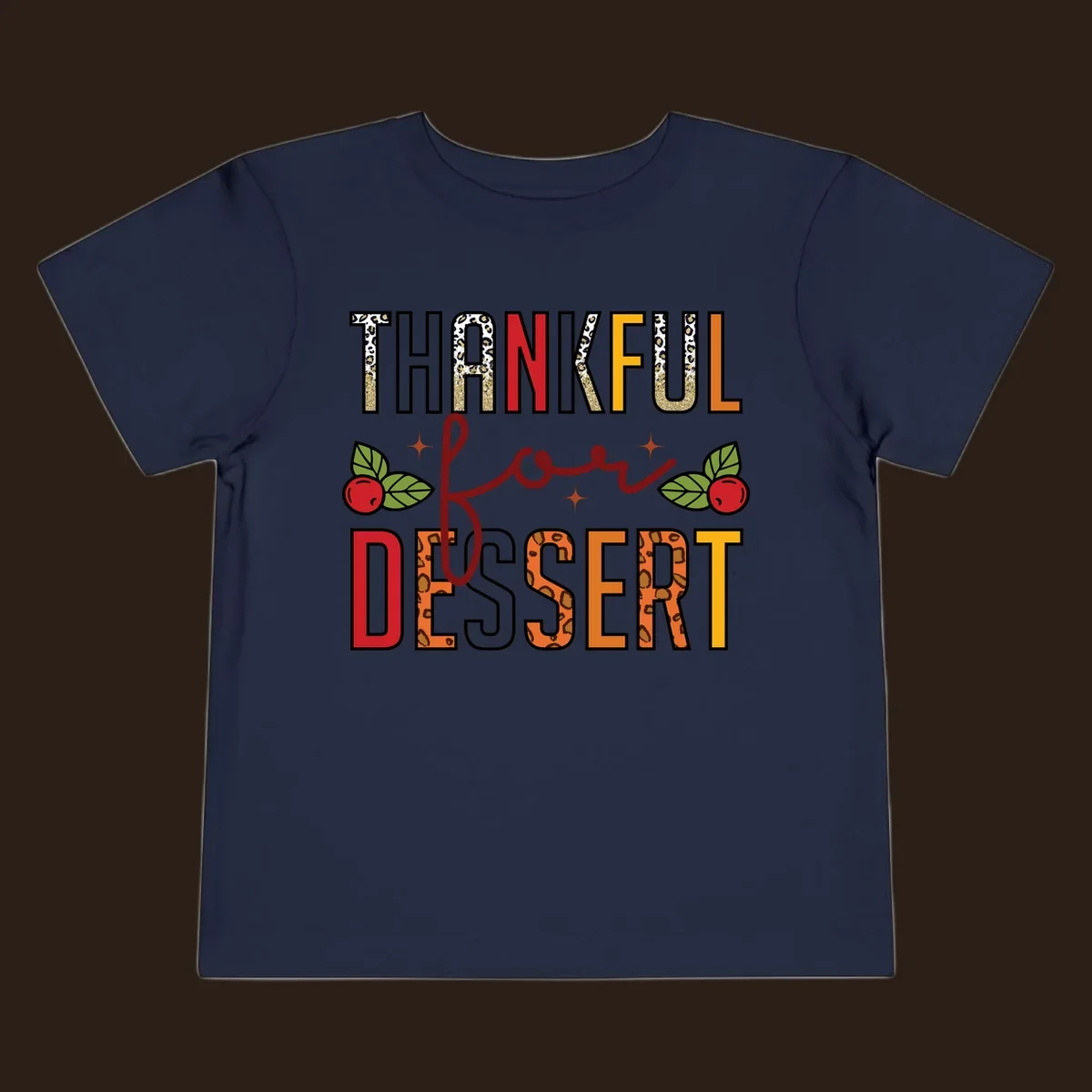 Thankful for Dessert typography with leopard print and cranberries on a dark background.