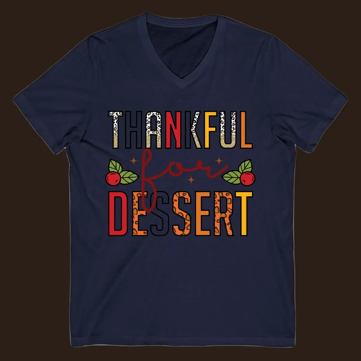 Thankful for Dessert typography with leopard print and cranberries on a dark background.