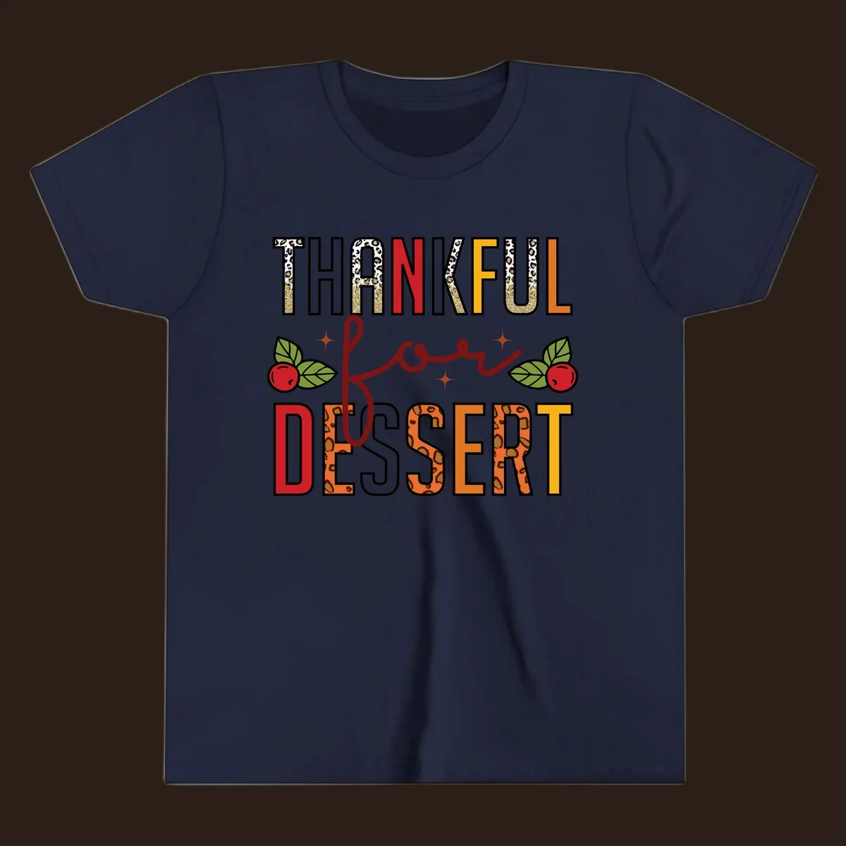 Thankful for Dessert typography with leopard print and cranberries on a dark background.