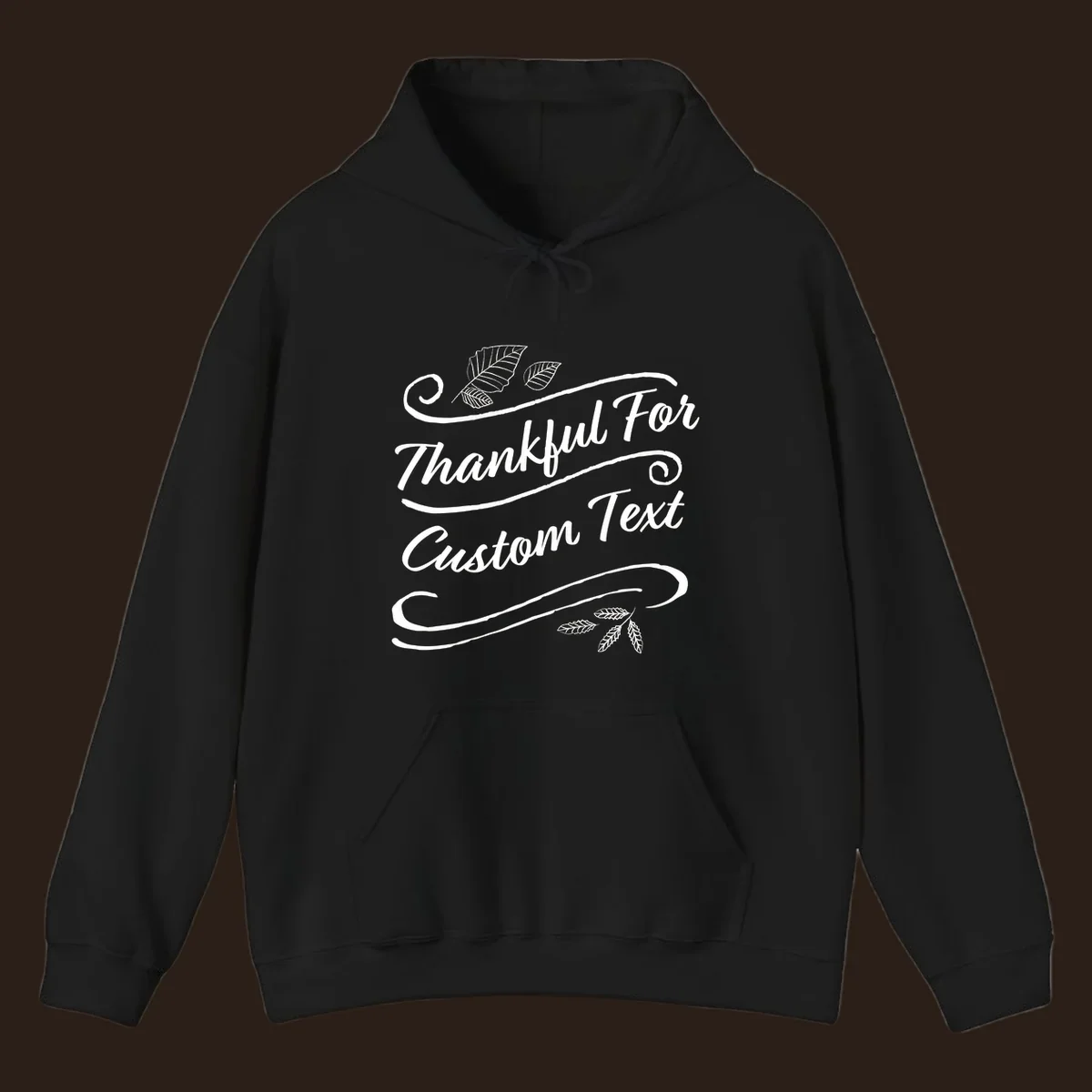 Custom Thanksgiving text design with leaves and swirls.