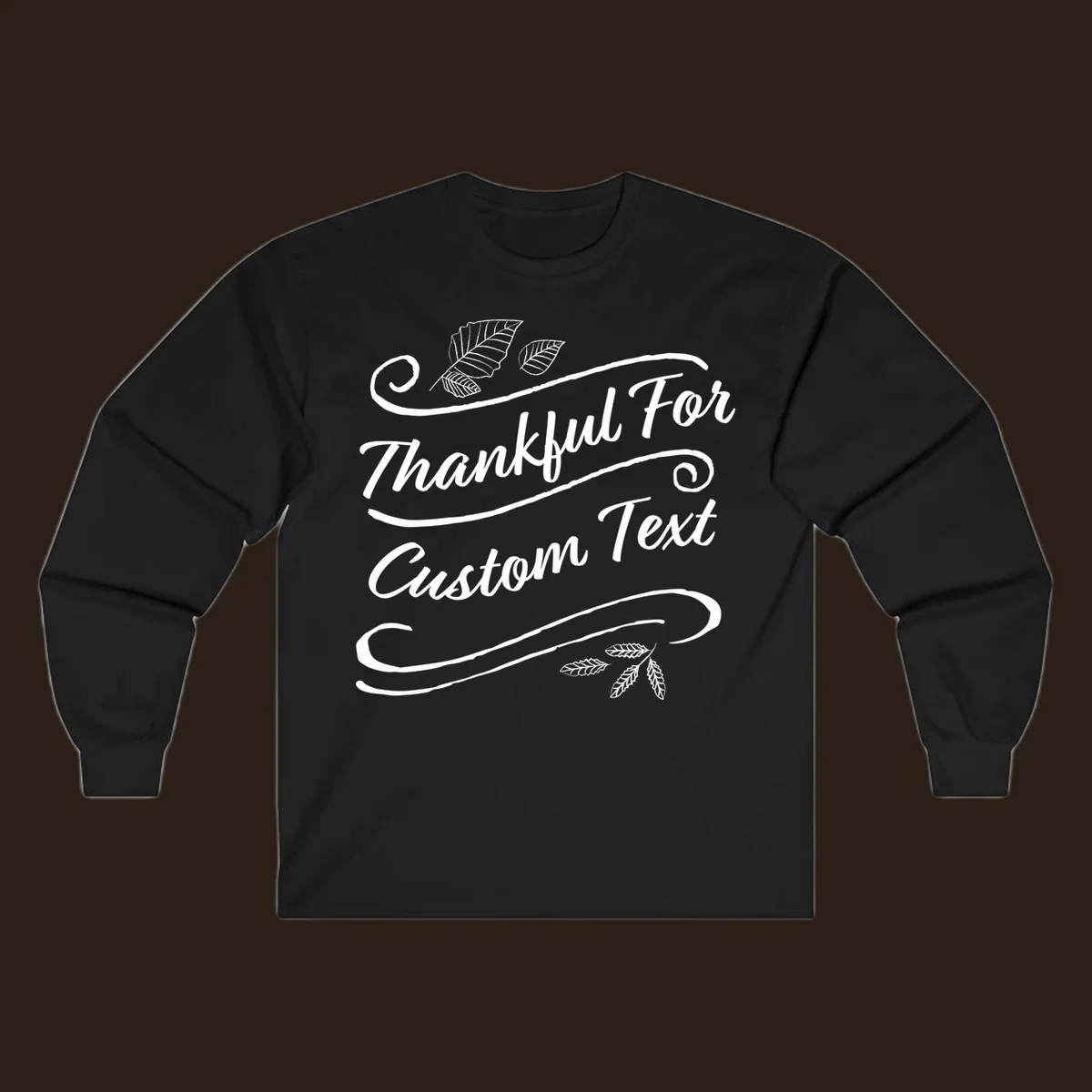 Custom Thanksgiving text design with leaves and swirls.