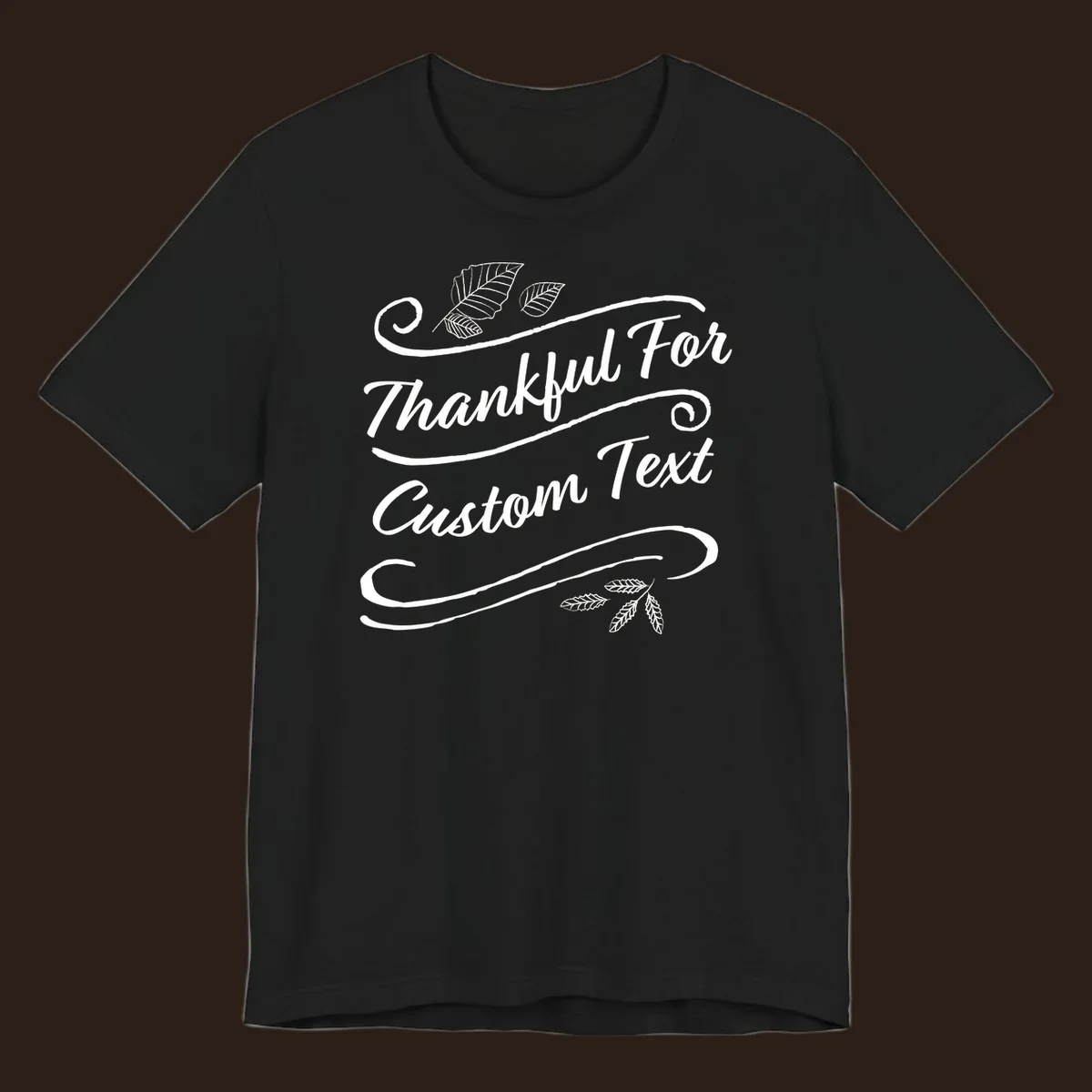 Custom Thanksgiving text design with leaves and swirls.