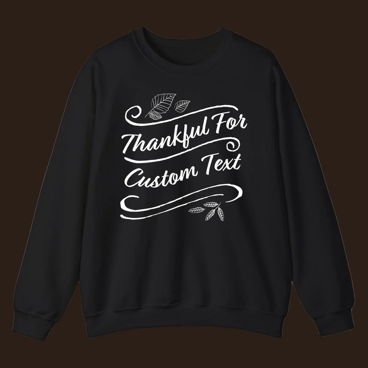 Custom Thanksgiving text design with leaves and swirls.