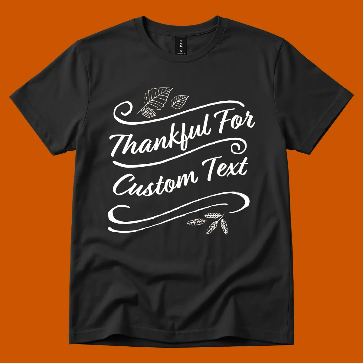 Custom Thanksgiving text design with leaves and swirls.