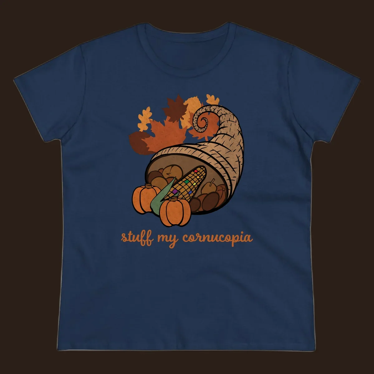Cornucopia overflowing with harvest food and autumn leaves, with text 'stuff my cornucopia'.