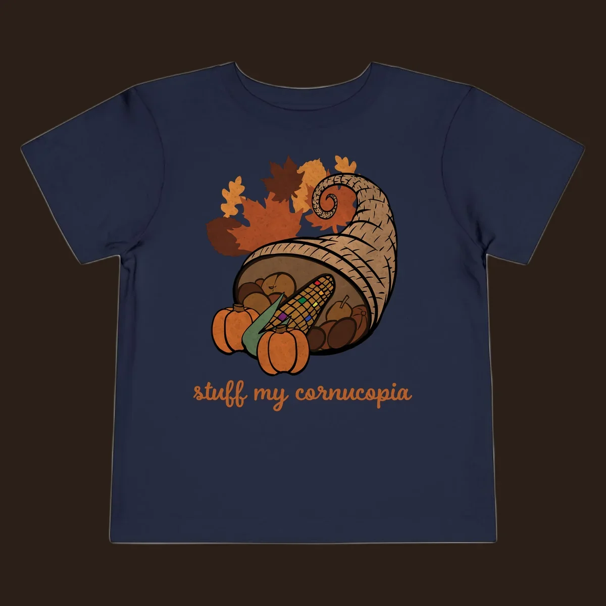 Cornucopia overflowing with harvest food and autumn leaves, with text 'stuff my cornucopia'.