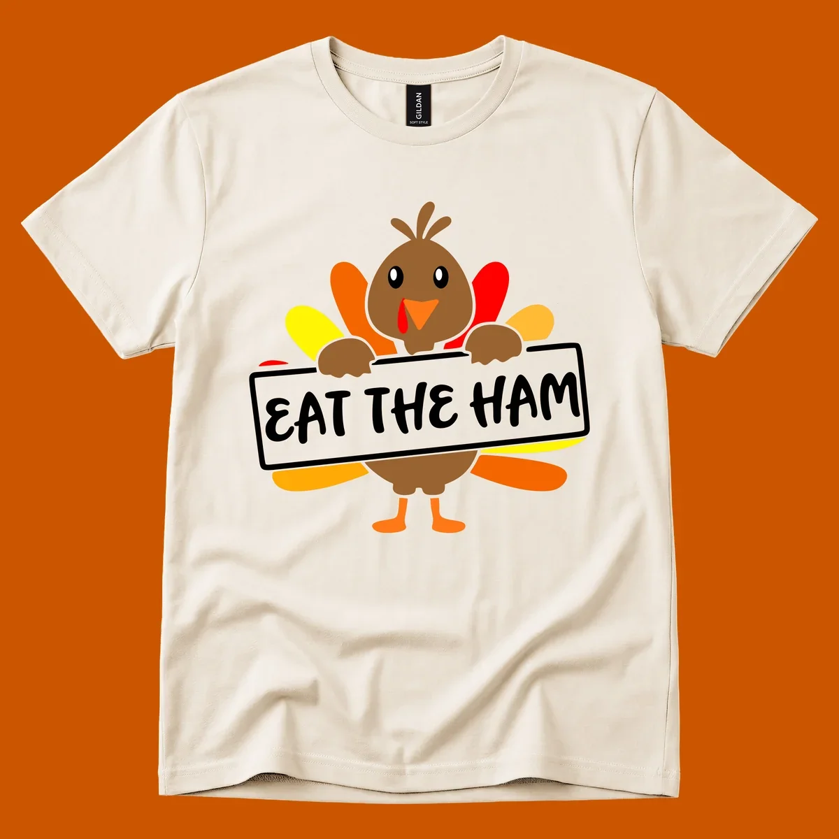 Cartoon turkey holding a sign that says EAT THE HAM, thanksgiving holiday.