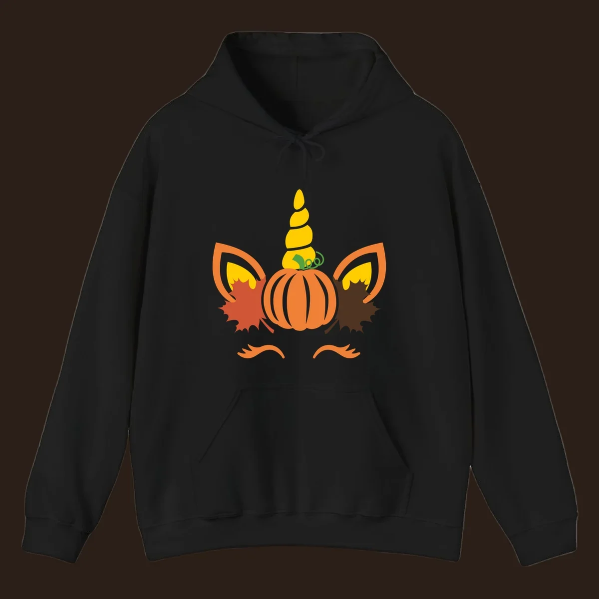 Autumn unicorn pumpkin face with fall leaves graphic.