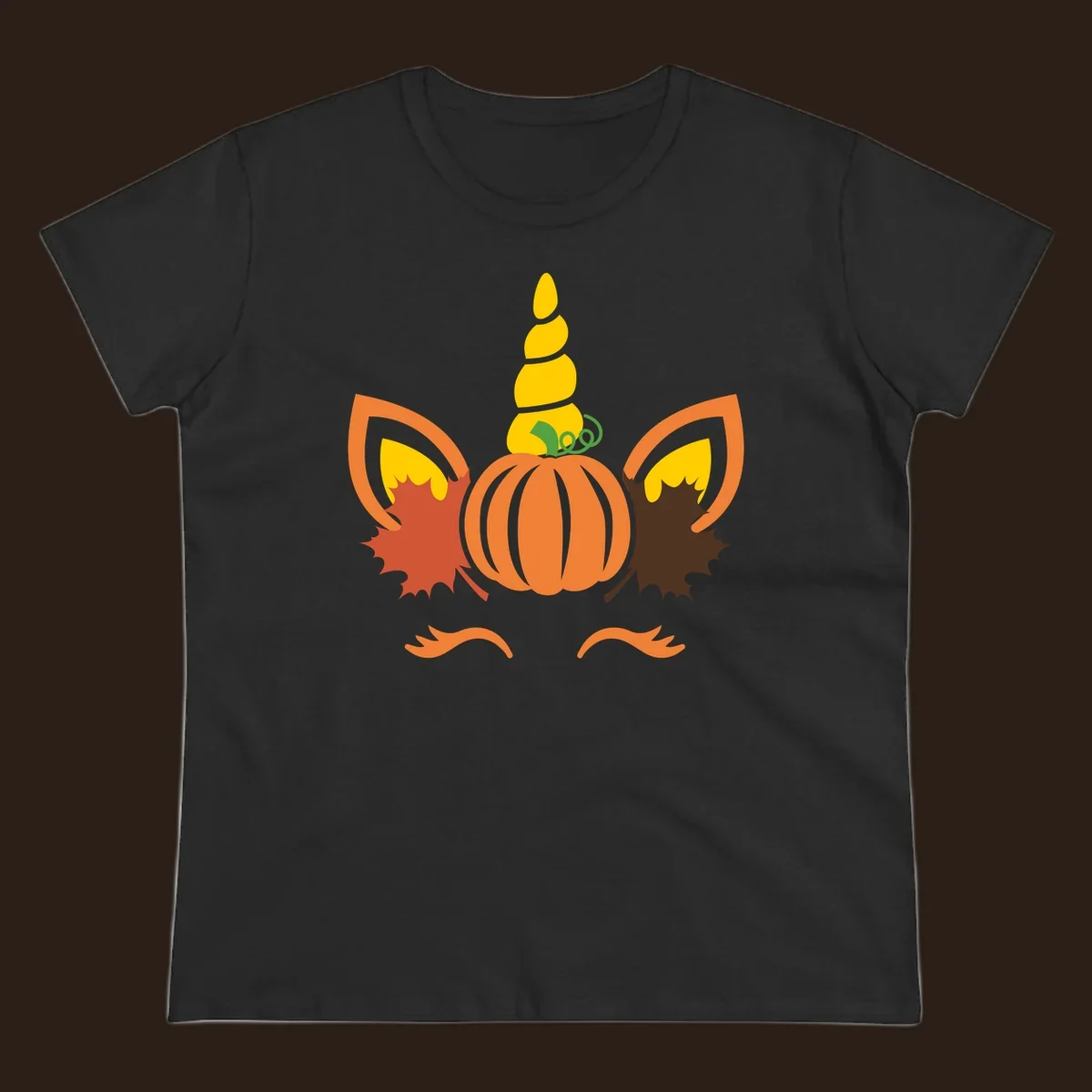 Autumn unicorn pumpkin face with fall leaves graphic.